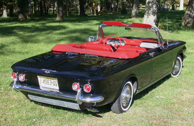 Black Corvair Monza Convertible top down from behind
