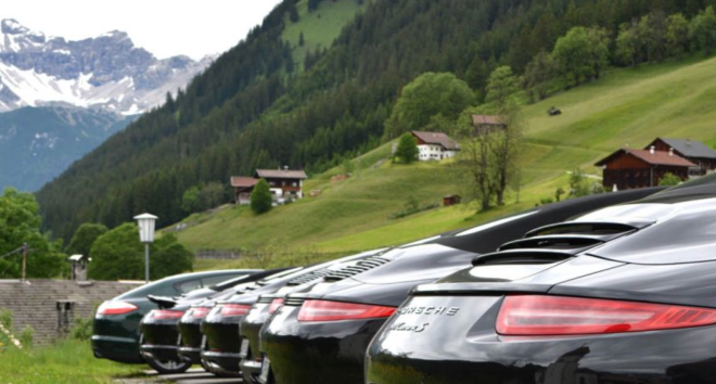 Porsches driving through the Alps