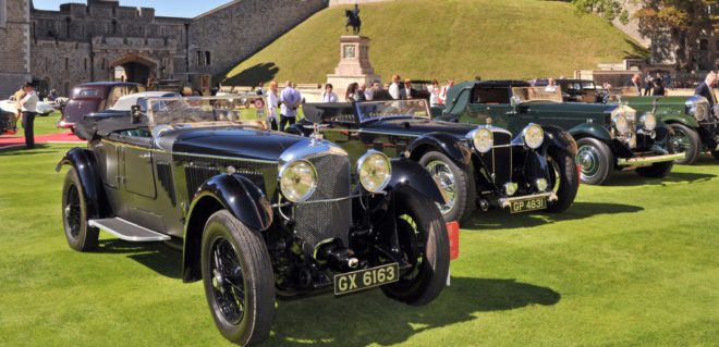 Line of antique Bentleys, Rolls-Royces, and Jaguars
