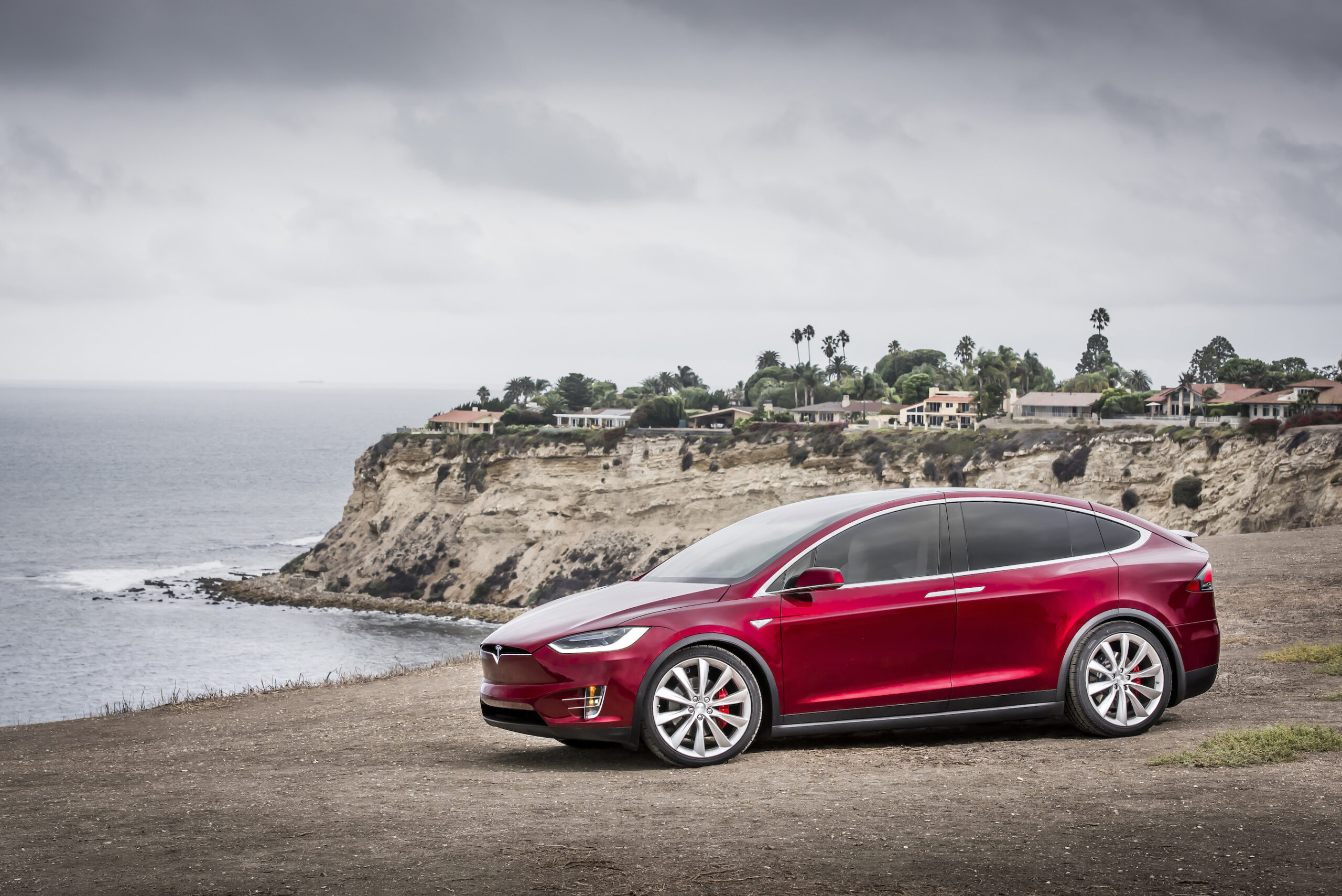 Red Tesla Model X On Shore