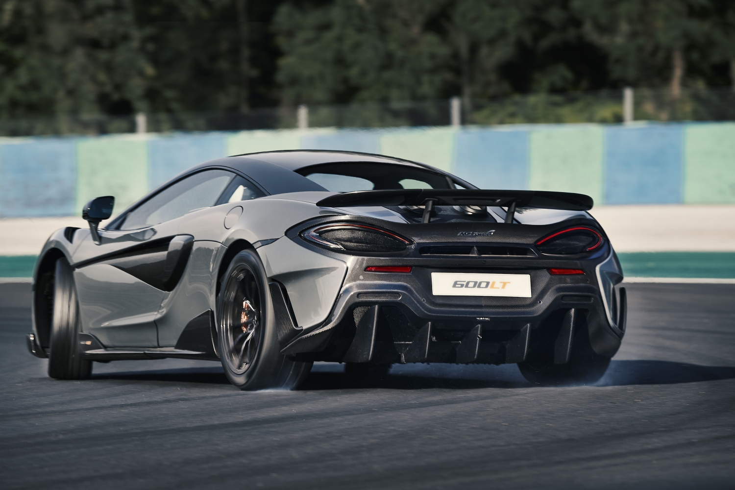 Model Perspective: McLaren 600LT Rear View of Gray Longtail Making It's Way Along The Track Exotic Car Loans