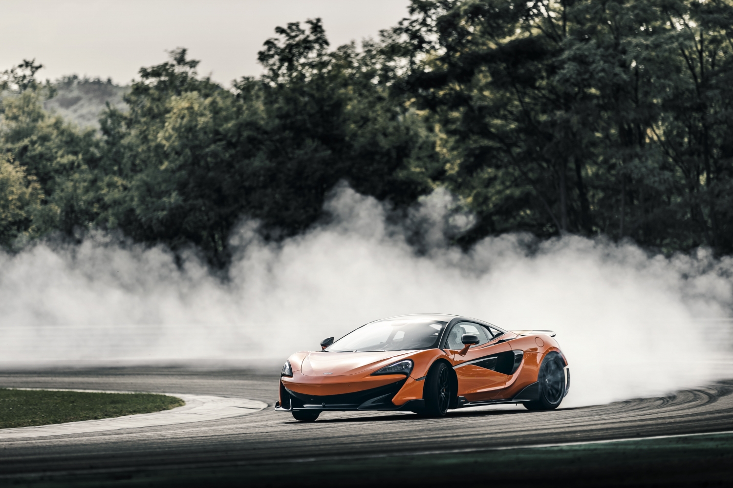 Model Perspective: McLaren 600LT Orange Longtail Tearing Up Track. SportsCar Financing