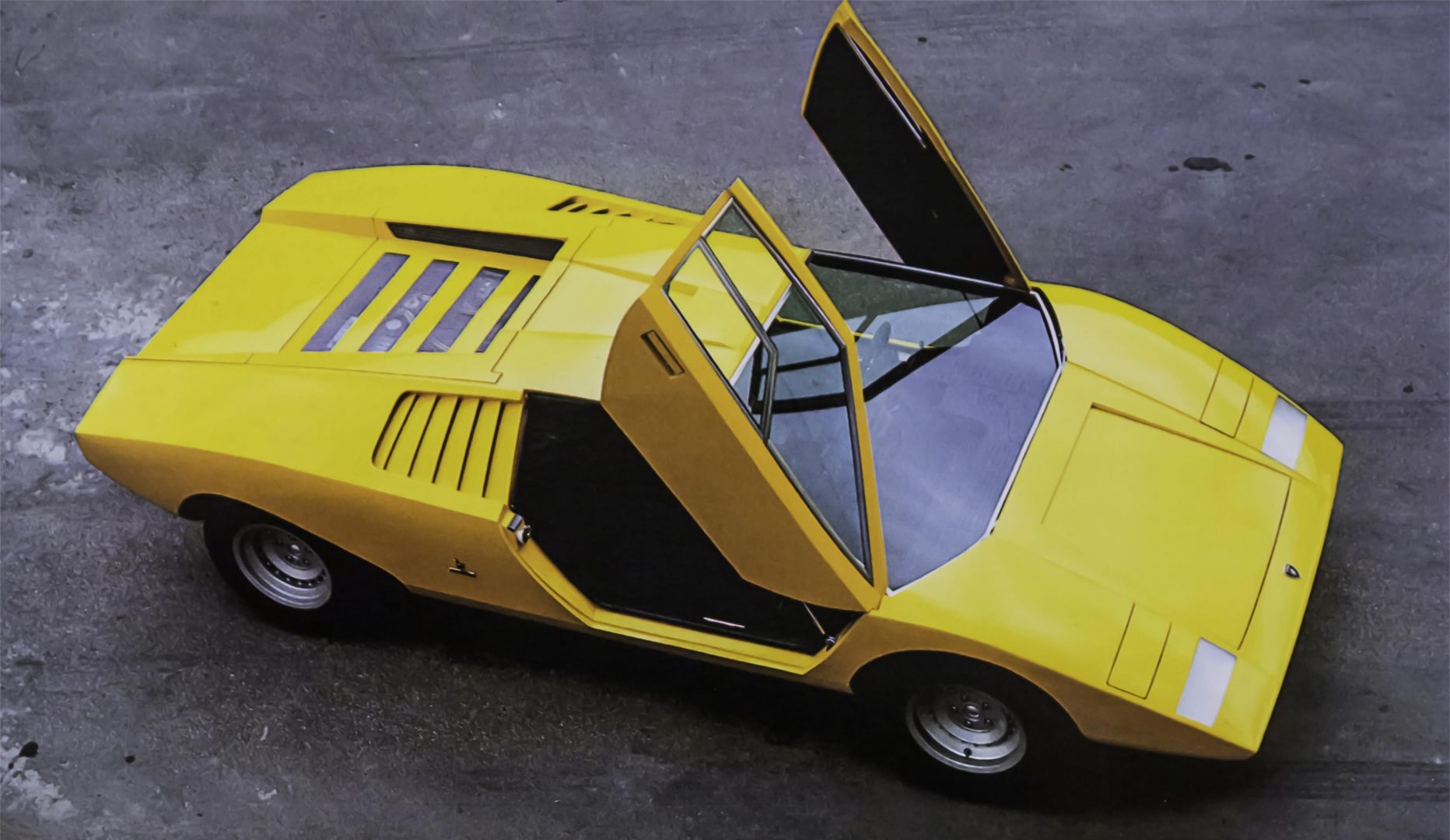 Black and white photo of 1971 Lamborghini Countach LP500 doors open, Exotic Car Financing