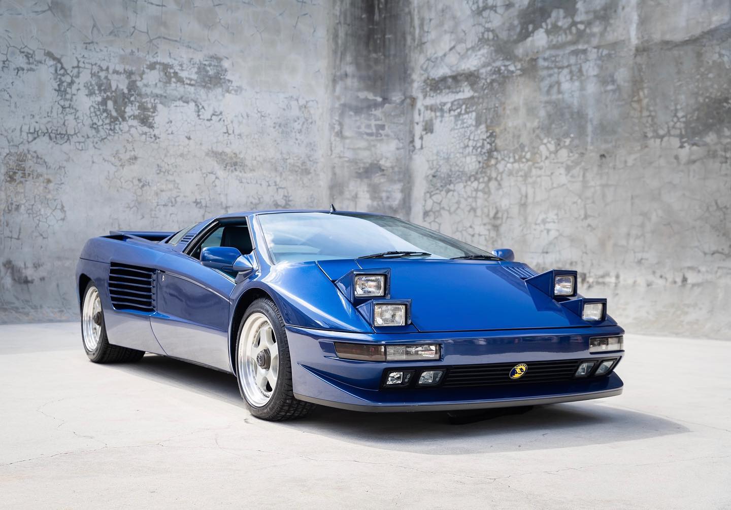 1993 Electric Blue Cizeta v16T - Chassis #101. Stark Concrete Background. Lease an Exotic Car with Premier