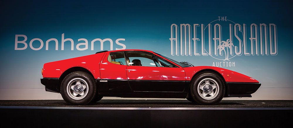 Red Ferrari on Bonham's bidding stage at Amelia Island Auctions