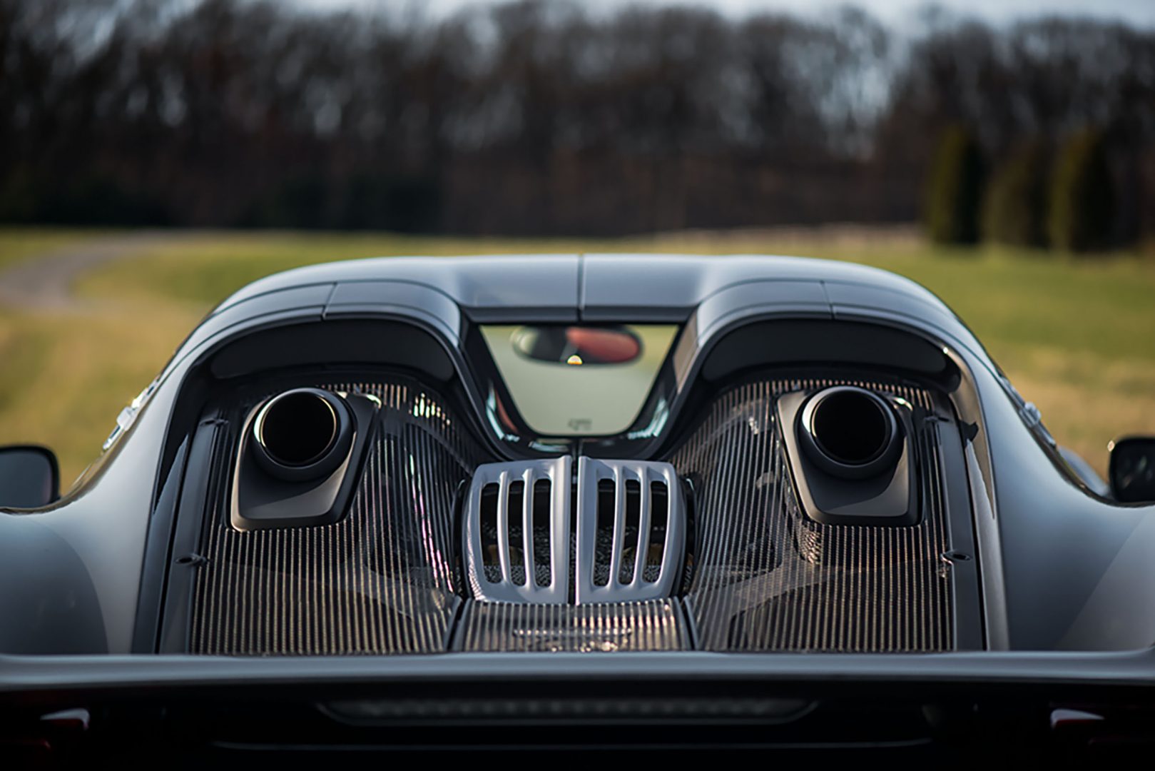 Silver Porsche 918 Spyder Rear View of exhaust pipes and rear view mirror; Porsche Loan