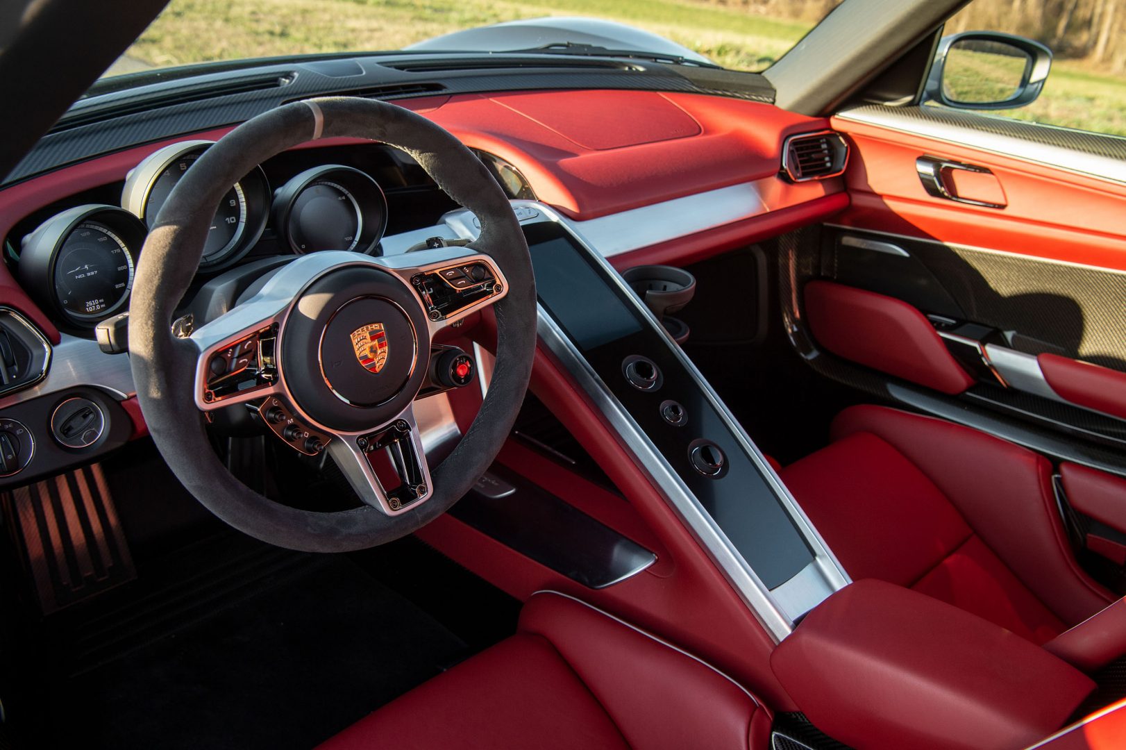 Silver Porsche 918 Spyder red cockpit leather interior; Lease a Porsche with Premier