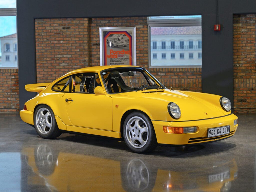 Yellow Porsche 911 Carrera 4 Lightweight front right view.
