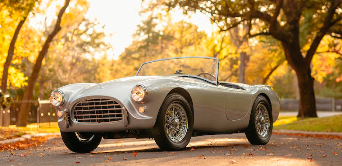 Silver 1958 AC Ace roadster, front left view.