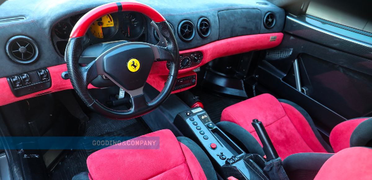 Ferrari 360 Challenge Stradale black and red interior. Red Ferrari 360 Challenge Stradale front right three-quarter view