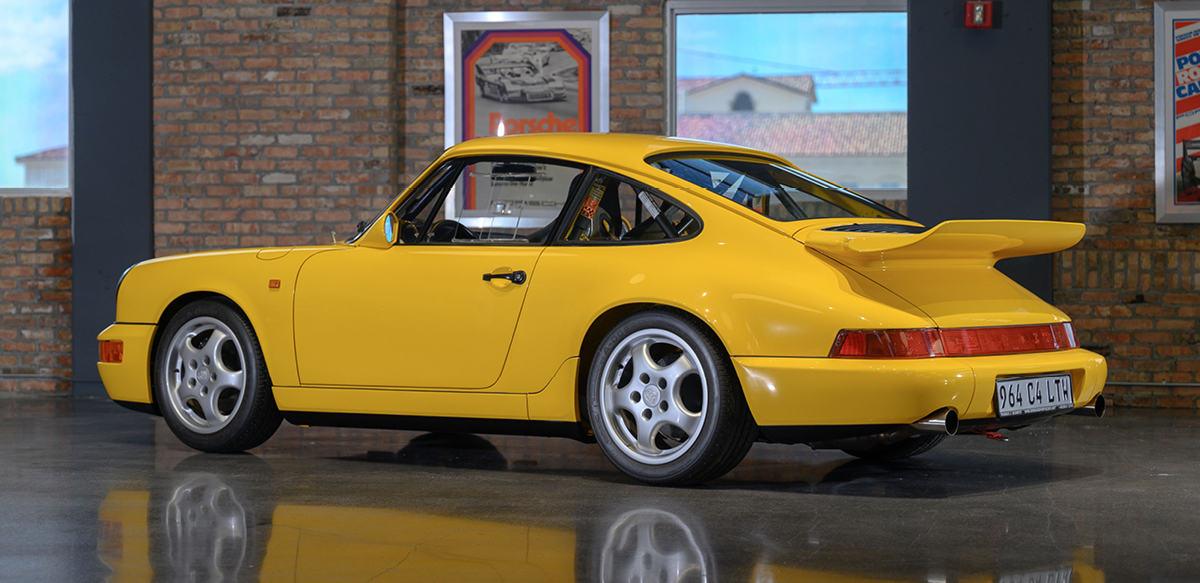 Yellow Porsche 911 Carrera 4 Lightweight left rear view