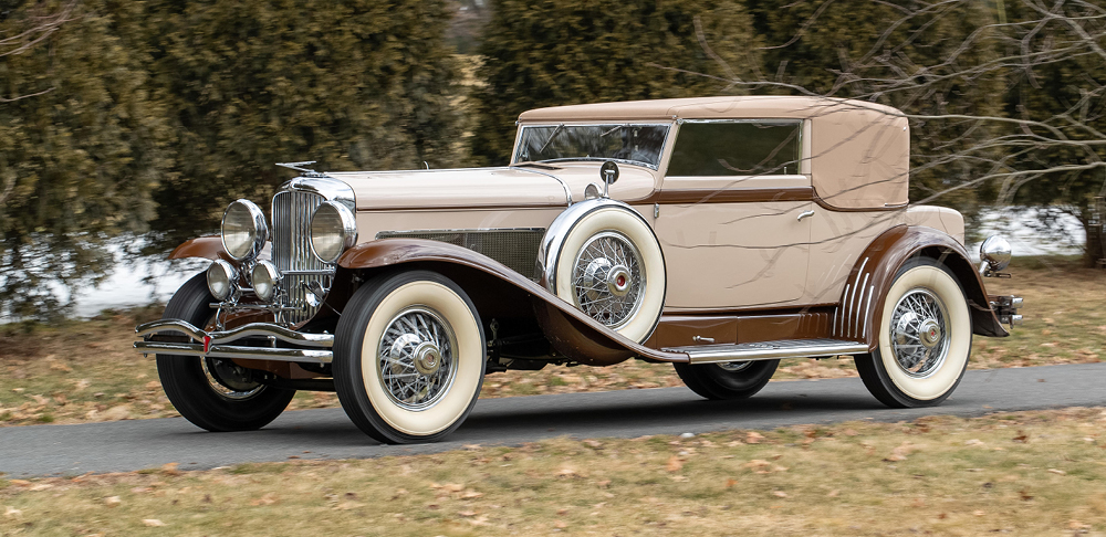 Tan 1929 Duesenberg Model J Convertible left side view