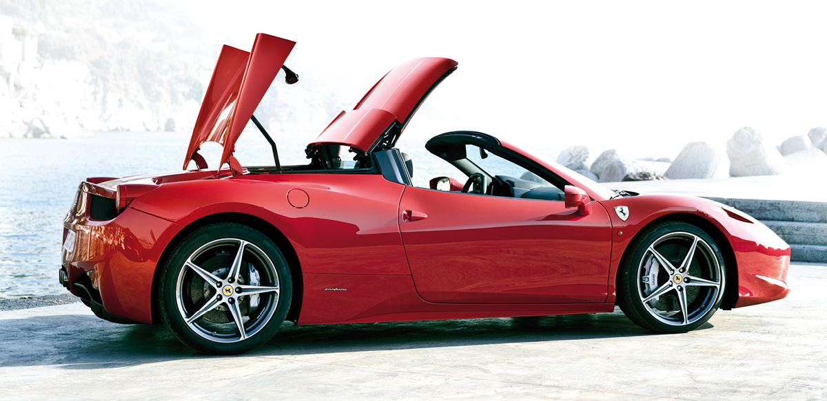 Red Ferrari 458 Spider top lowering