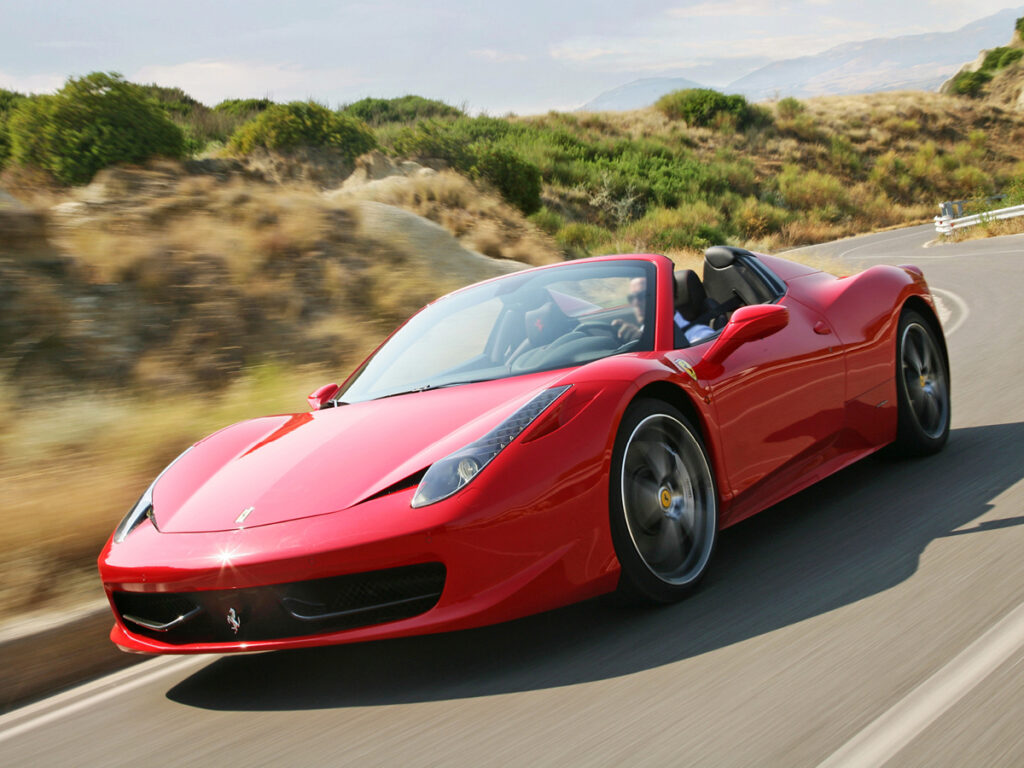 Red Ferrari 458 Spider on road