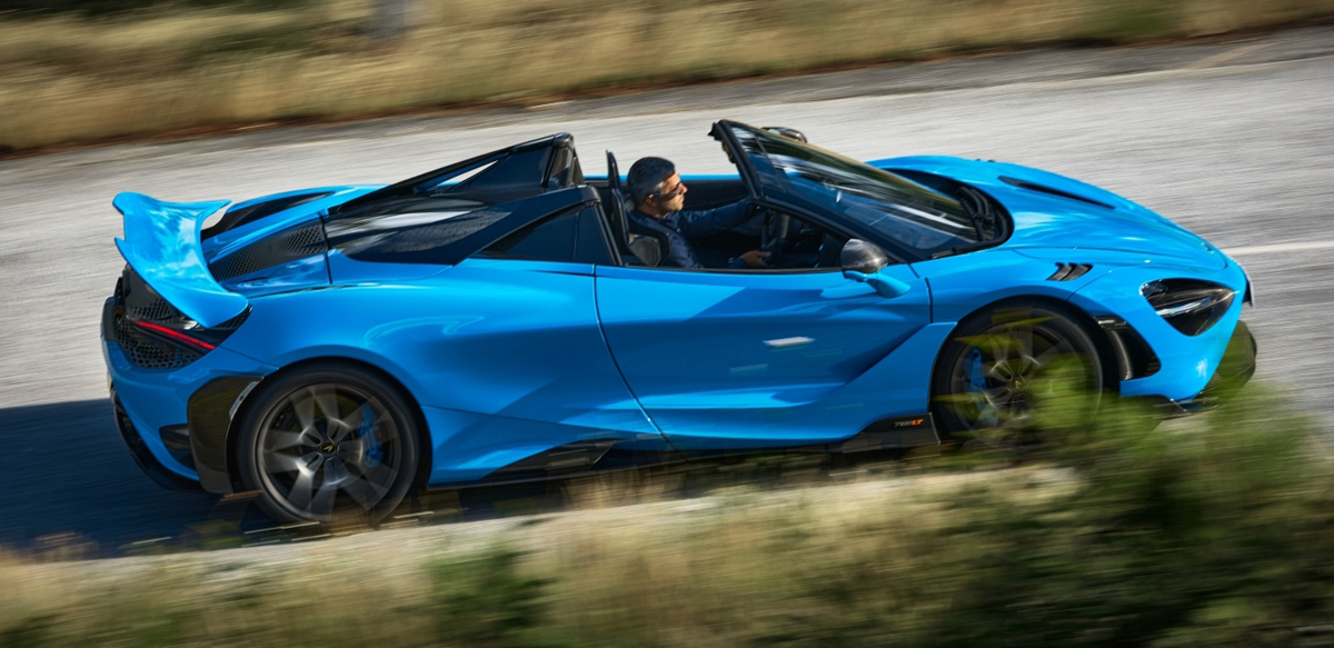 Blue McLaren 765LT Spider on road, side view