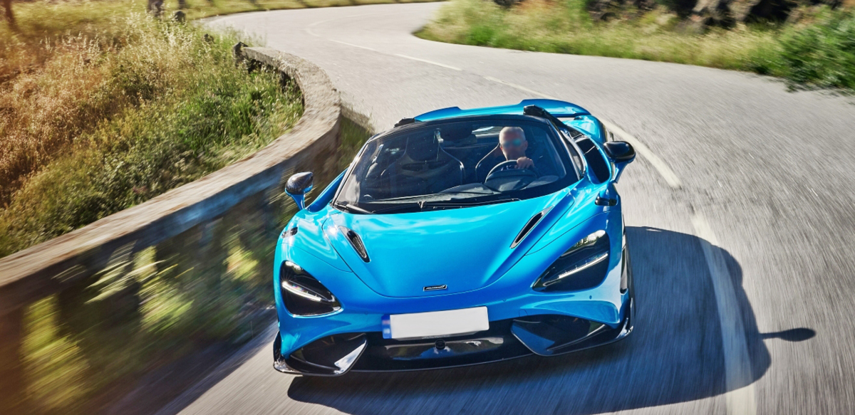 Blue McLaren 765LT Spider on road