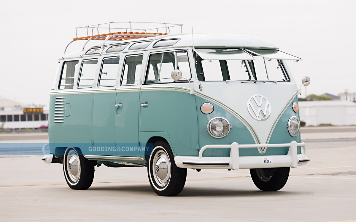 Green and white 1962 VW bus front right view.