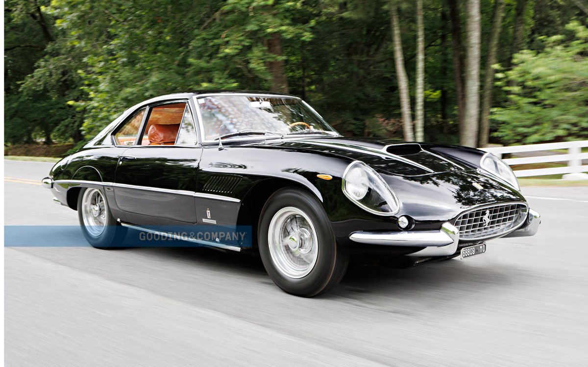 Black 1961 Ferrari Superamerica driving on road