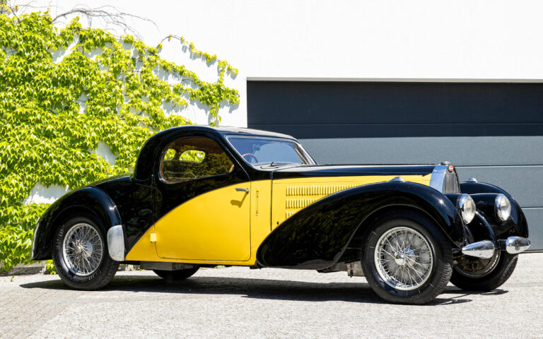 Black and yellow 1937 Bugatti Type 57 Atalante front left view