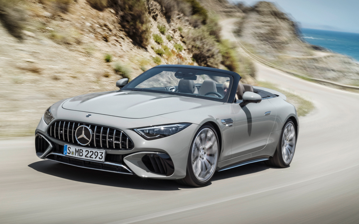 Gray Mercedes-AMG SL on road, left side view