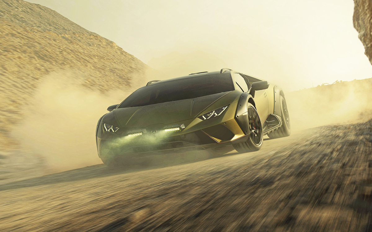 Green Lamborghini Huracán Sterrato driving in dirt