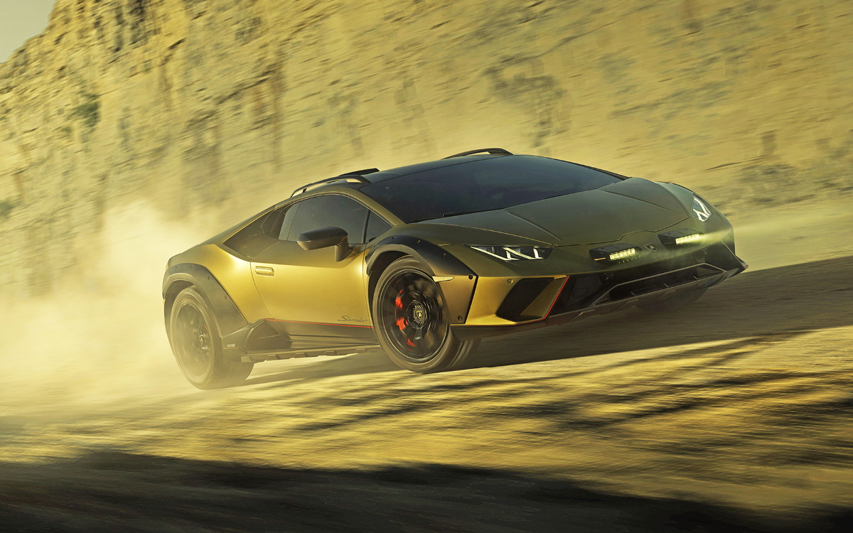 Green Lamborghini Huracán Sterrato driving in dirt