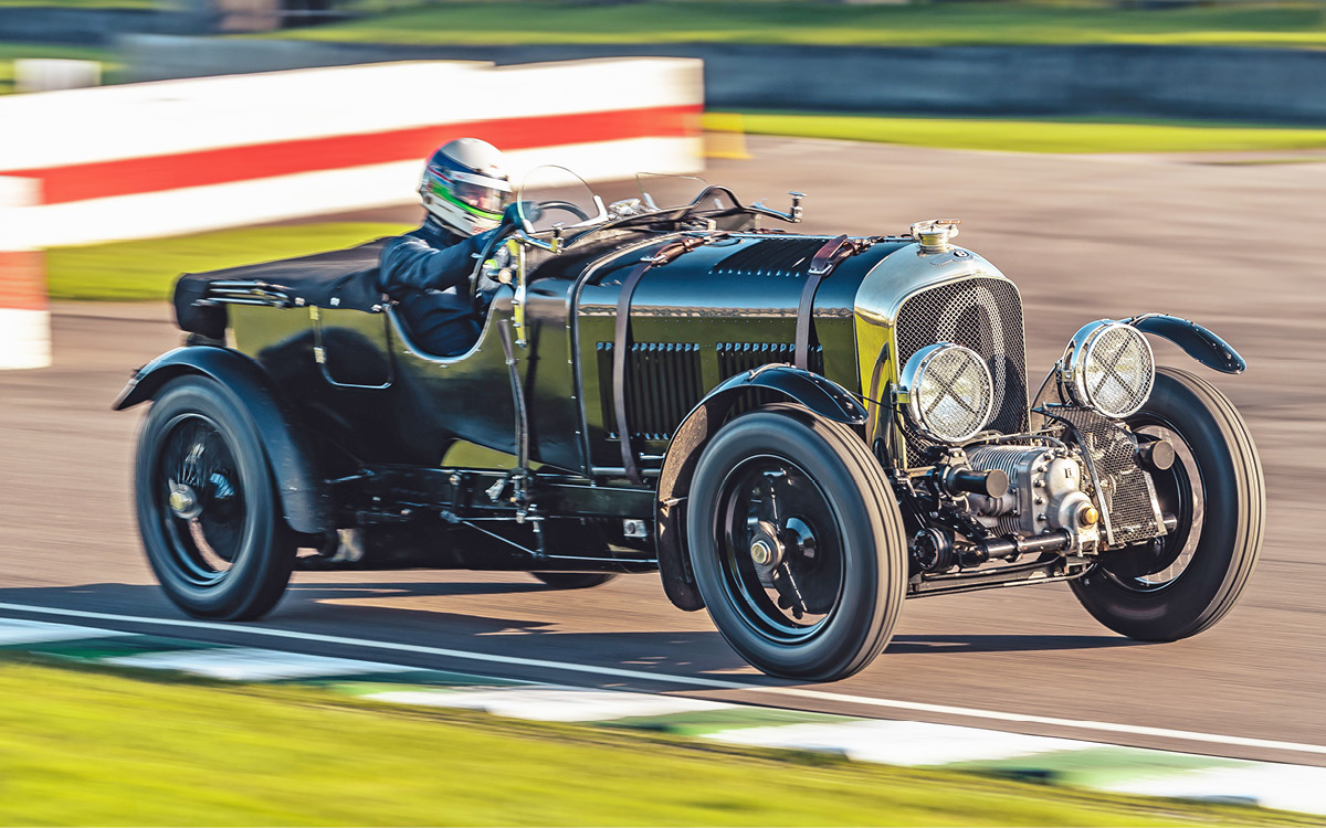 Green Bentley Blower Continuation Series Car Zero on racetrack