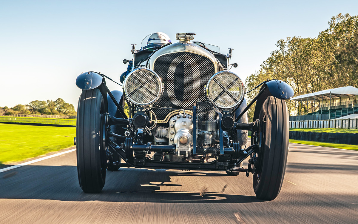 Green Bentley Blower Continuation Series Car Zero on racetrack, front view