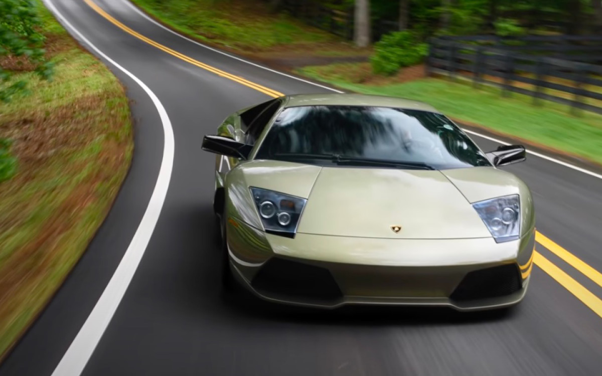 Green Lamborghini Murciélago on the road, front view