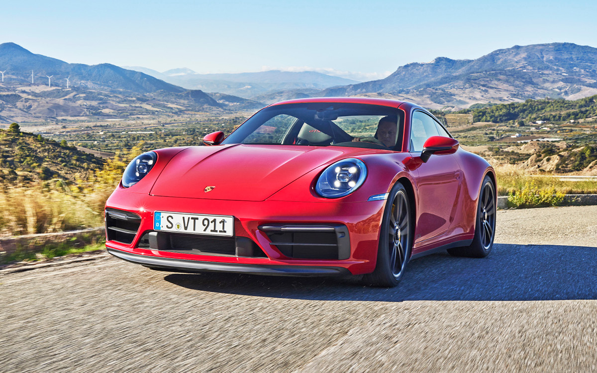 Red Porsche 911 Carrera GTS on road, front view