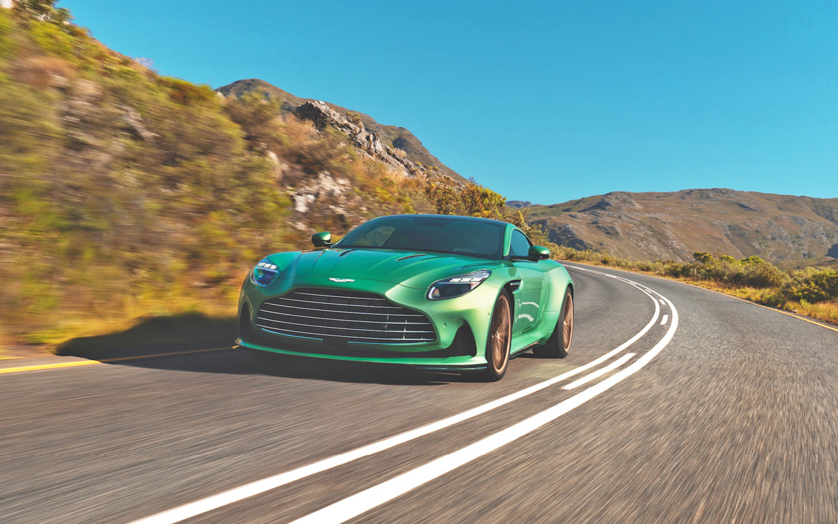 Green Aston Martin DB12 on road, left front view