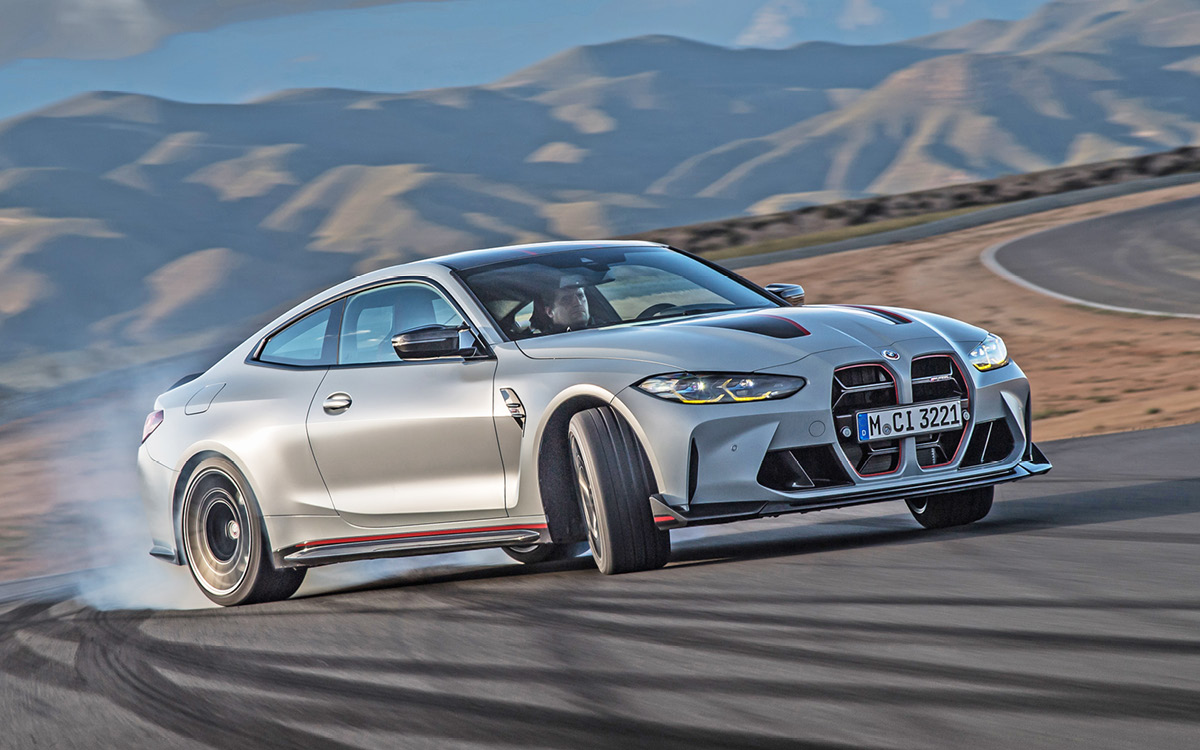 Gray BMW M4 CSL on track, front view, in action