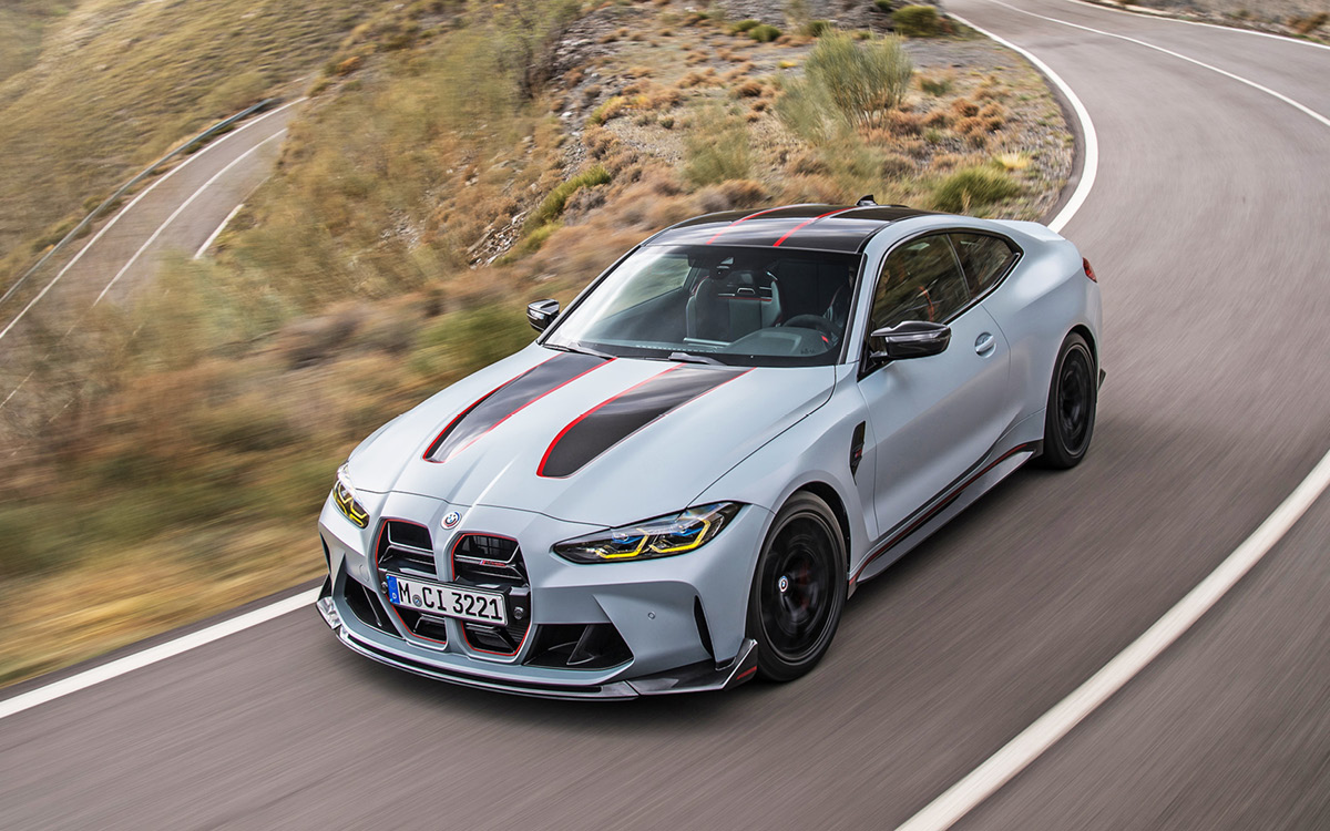 Gray BMW M4 CSL on road, high view