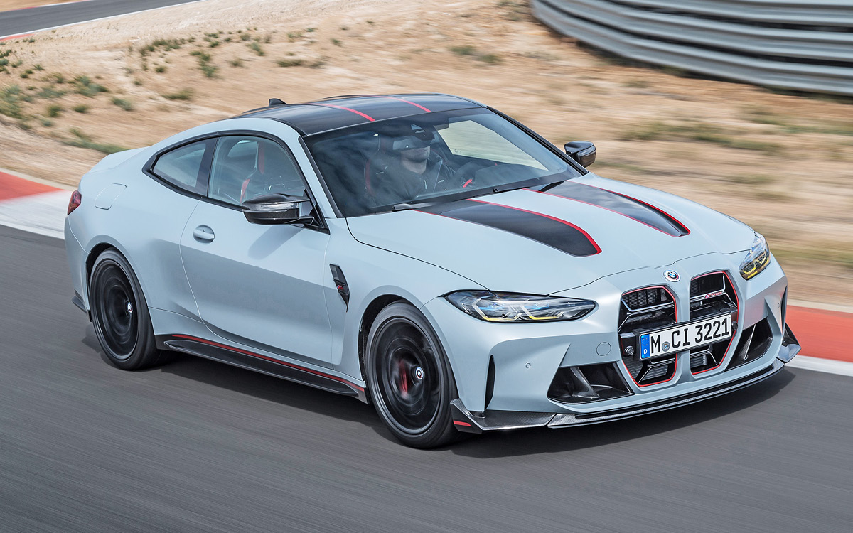 Gray BMW M4 CSL on track, high side view, in action