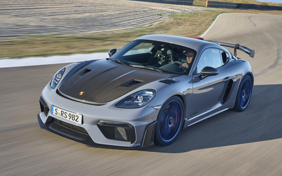 Arctic Gray 2023 Porsche 718 Cayman GT4 RS on track.