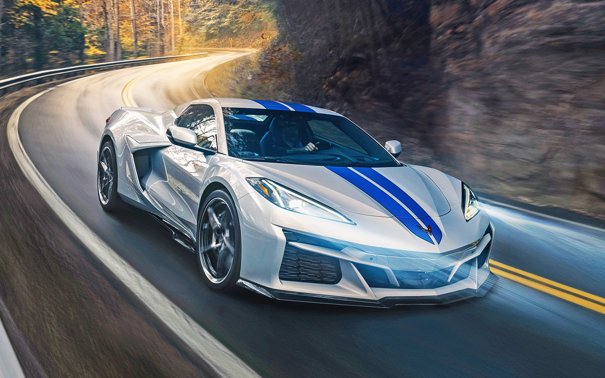 Silver Corvette E-Ray on country road, front view.