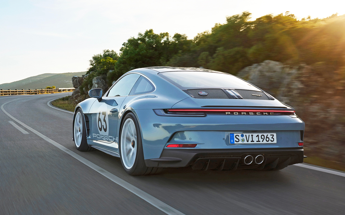 Shore Blue Metallic Porsche 911 S/T rear view on road