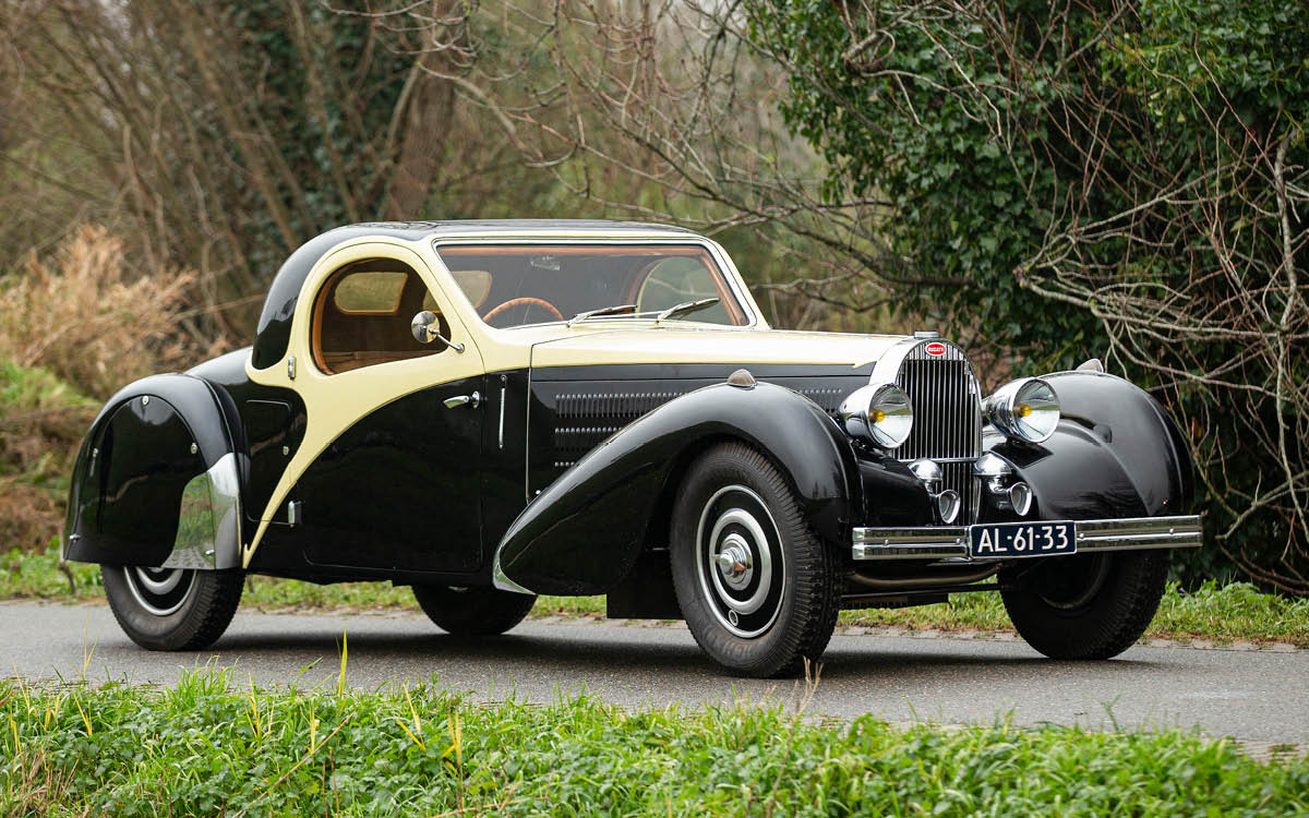 Yellow and black 1936 Bugatti Atalante, right front view