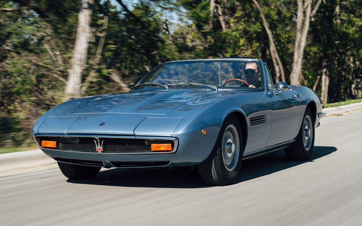 Light blue Maserati Ghibli Spider on road