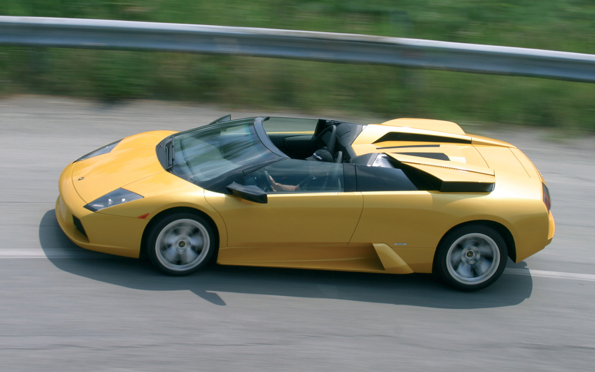 Yellow Lamborghini Murciélago on road