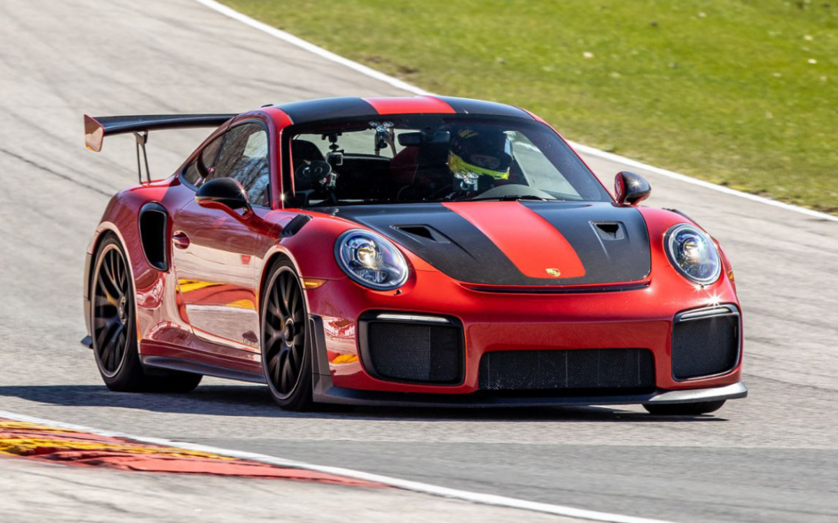 Red Porsche 911 GT2 RS on racetrack hill, front view