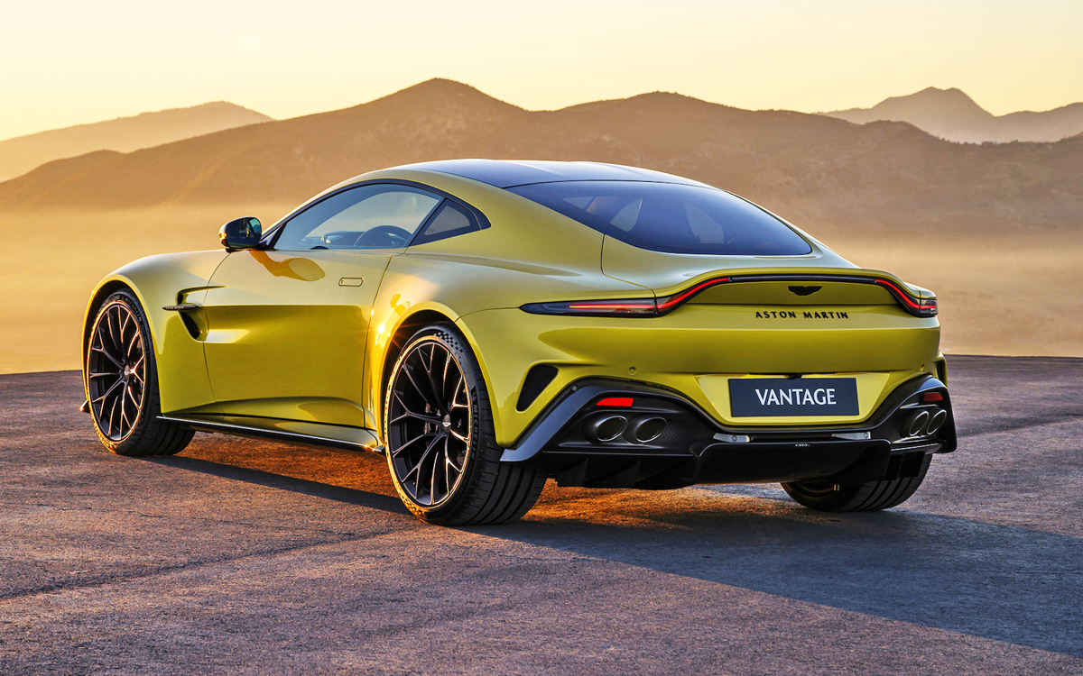 Yellow 2025 Aston Martin Vantage left rear view