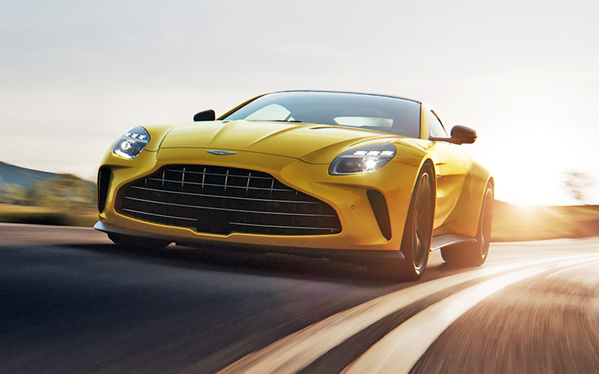 Yellow 2025 Aston Martin Vantage on road front view