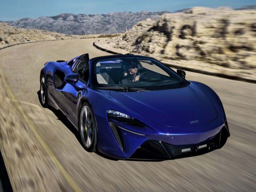Blue McLaren Artura Spider on road front view