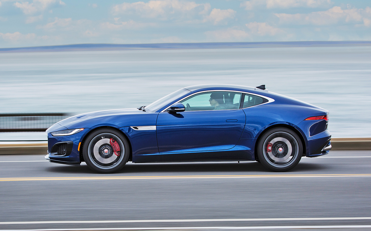 Blue Jaguar F-Type coupe on road