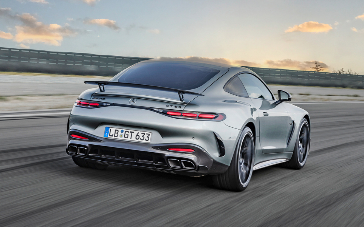 Silver 2024 AMG GT on the road, rear view